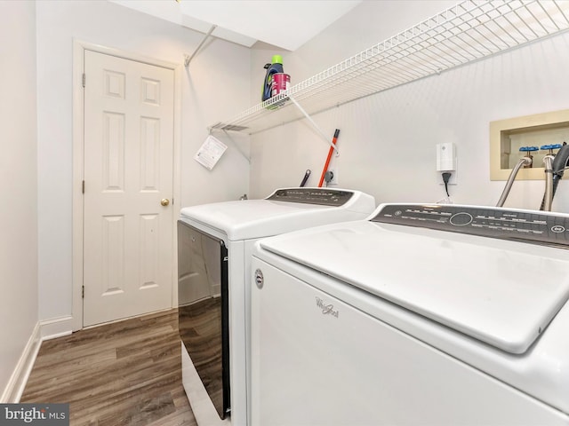 109 Rock Creek Ct, Frederick, MD 21702 - laundry area with wood finished floors, washer and clothes dryer, laundry area, and baseboards