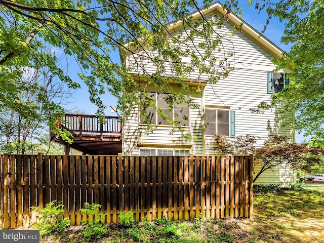 109 Rock Creek Ct, Frederick, MD 21702 - rear view of house with a deck and fence private yard