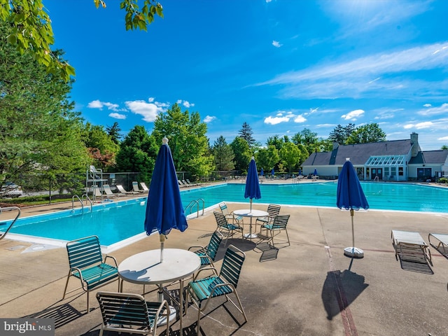 109 Rock Creek Ct, Frederick, MD 21702 - community pool with a patio area and fence