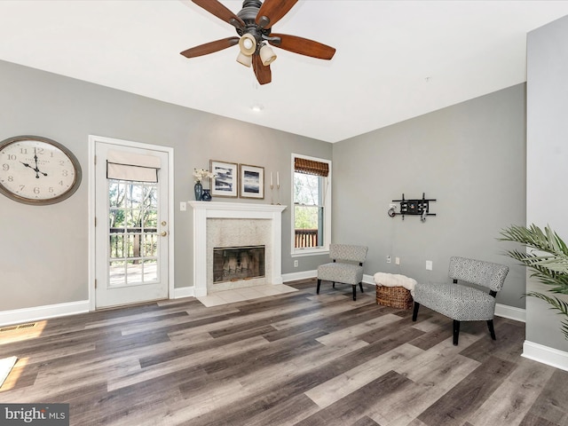 109 Rock Creek Ct, Frederick, MD 21702 - sitting room featuring visible vents, wood finished floors, a healthy amount of sunlight, and a high end fireplace