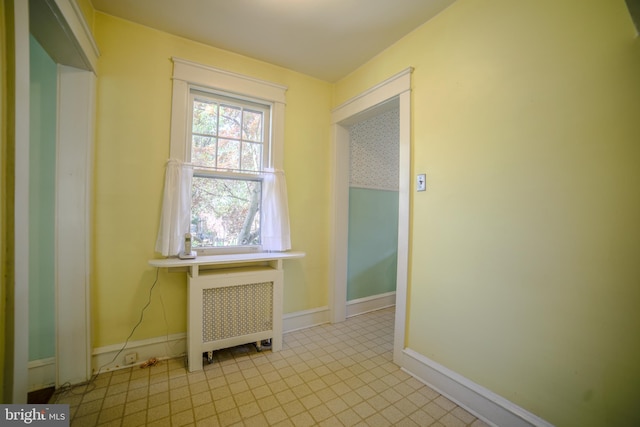 interior space featuring baseboards and radiator heating unit