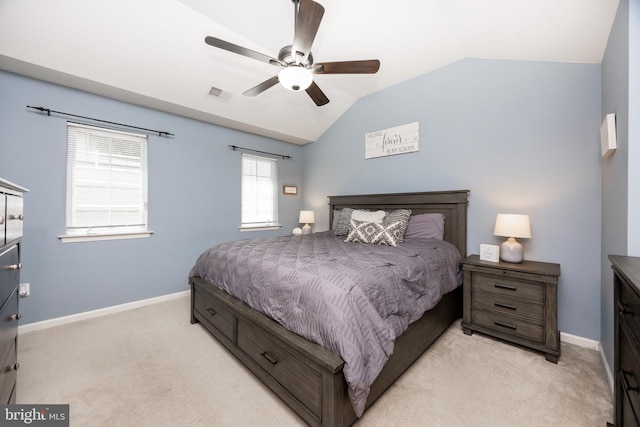 bedroom with baseboards, visible vents, light colored carpet, and lofted ceiling
