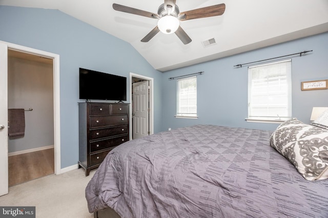 bedroom with carpet flooring, ceiling fan, baseboards, lofted ceiling, and visible vents