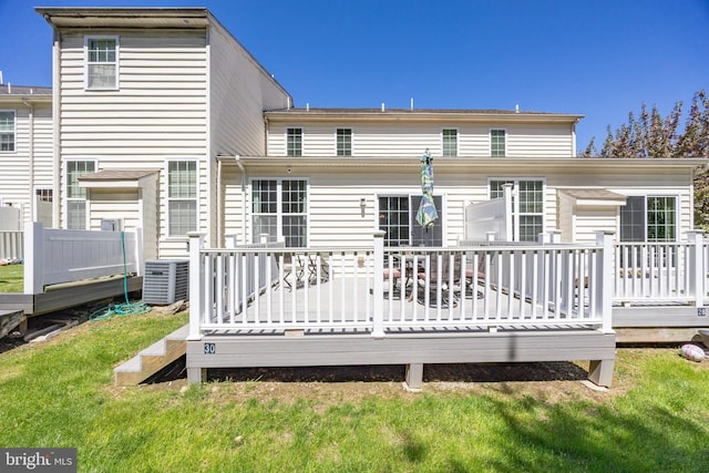 back of house with a yard, a wooden deck, and central AC unit