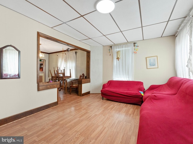 119 S Chester Ave, Riverside, NJ 08075 - living room featuring baseboards, a drop ceiling, and wood finished floors