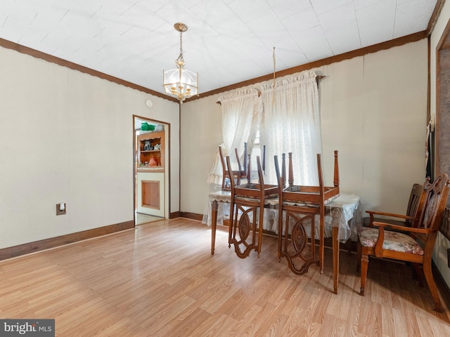 119 S Chester Ave, Riverside, NJ 08075 - dining room with crown molding, baseboards, a chandelier, and light wood-style flooring