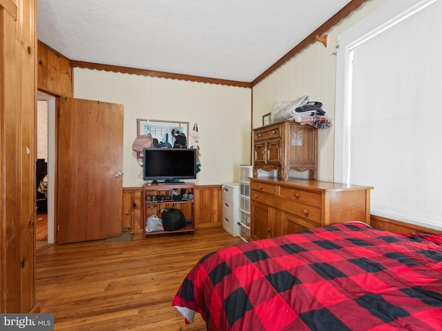 119 S Chester Ave, Riverside, NJ 08075 - bedroom featuring ornamental molding, wood finished floors, and wooden walls