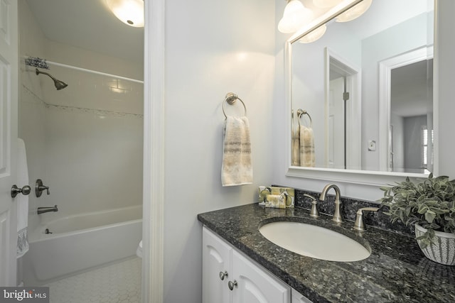 full bath featuring vanity, tile patterned floors, and shower / bath combination