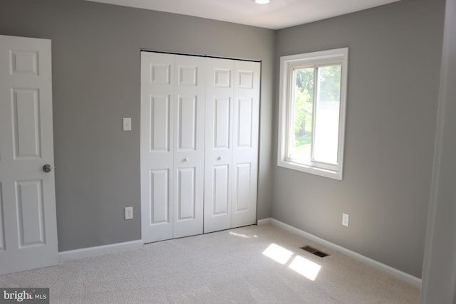 1029 Kings Ct, Herndon, VA 20170 - unfurnished bedroom featuring carpet flooring, a closet, baseboards, and visible vents