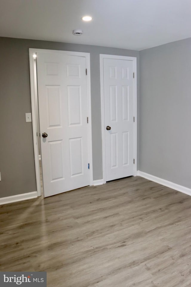 1029 Kings Ct, Herndon, VA 20170 - unfurnished bedroom featuring light wood finished floors, baseboards, a closet, and recessed lighting