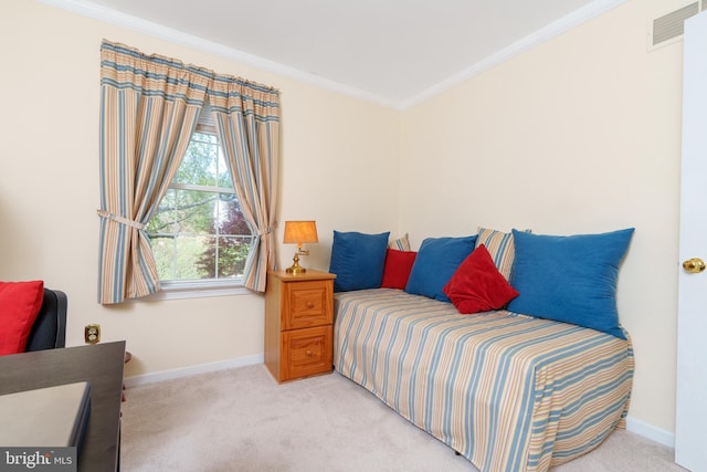 bedroom featuring light colored carpet, visible vents, ornamental molding, and baseboards