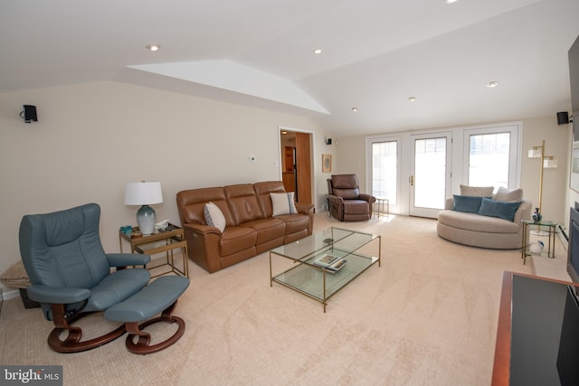 carpeted living room featuring recessed lighting and lofted ceiling