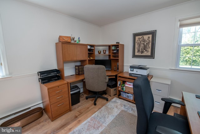 office area with crown molding, light wood-style floors, and a baseboard radiator