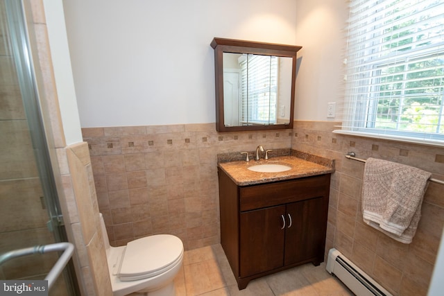 full bathroom featuring vanity, tile patterned floors, a wainscoted wall, tile walls, and a baseboard radiator