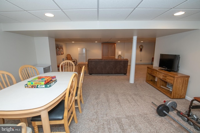 dining room featuring carpet floors, recessed lighting, and a paneled ceiling