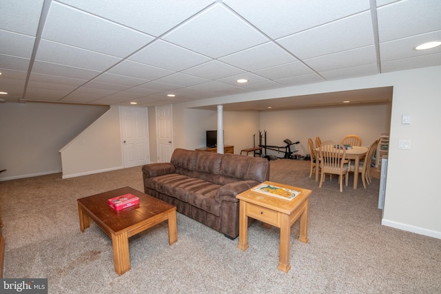 living area with recessed lighting, baseboards, light colored carpet, and a drop ceiling
