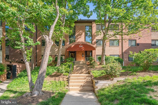 view of property with brick siding