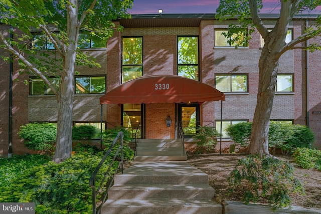 exterior space featuring brick siding