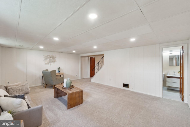 living area featuring baseboards, stairway, recessed lighting, and carpet floors