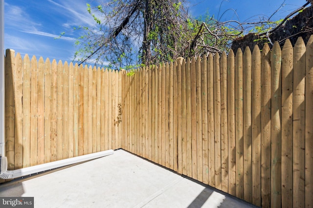 exterior space with fence and a patio area