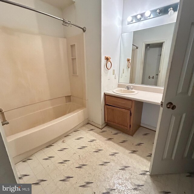 full bath with shower / bathtub combination, vanity, and tile patterned floors