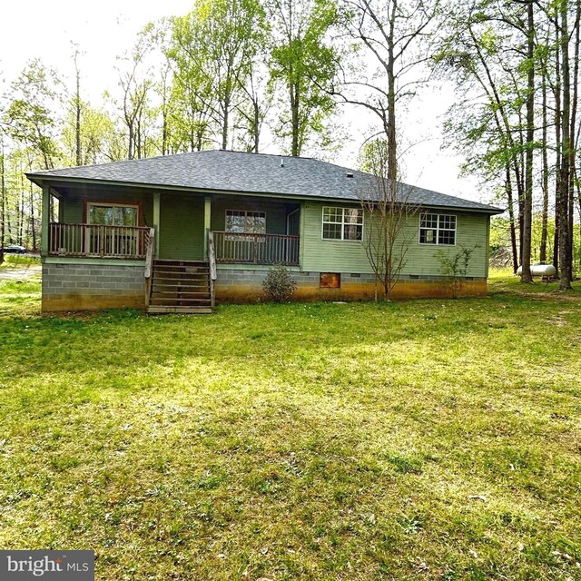 rear view of property with crawl space, a porch, a yard, and a shingled roof