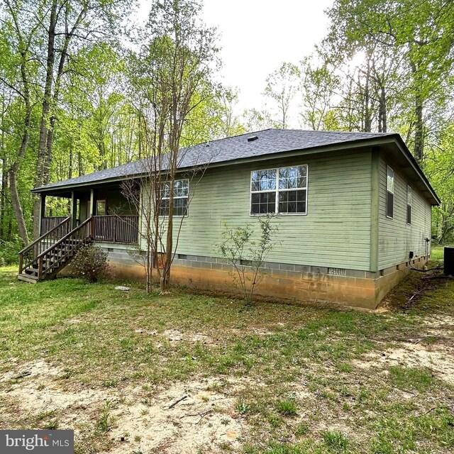 exterior space featuring central AC, crawl space, and covered porch