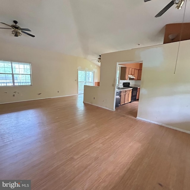 unfurnished living room featuring light wood-style floors, a ceiling fan, and baseboards