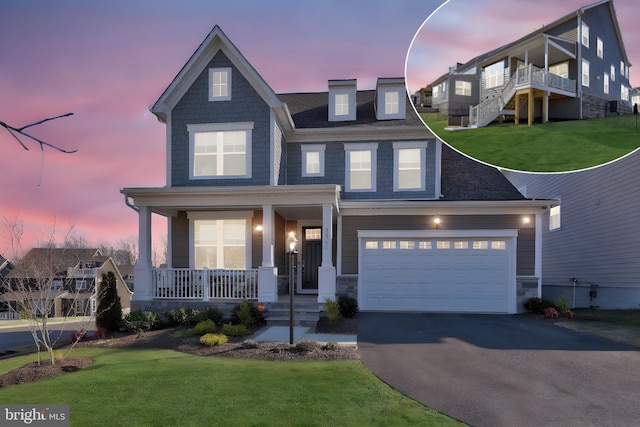 craftsman house featuring a garage, driveway, a front lawn, and covered porch