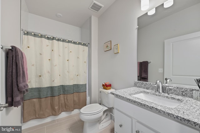 full bathroom featuring visible vents, vanity, and toilet