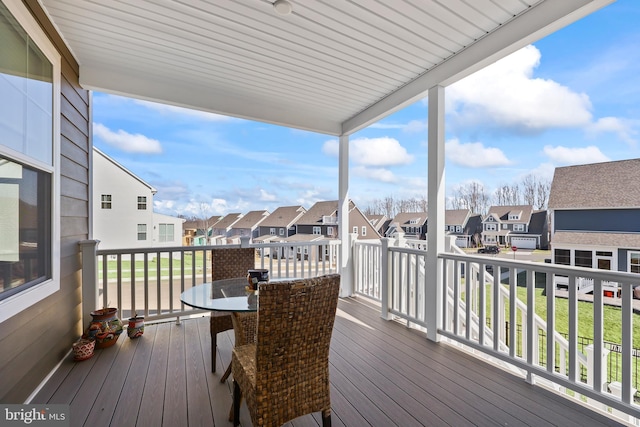wooden deck featuring a residential view