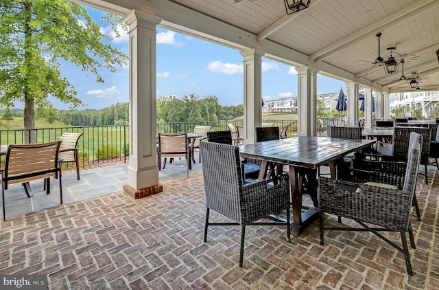 view of patio / terrace featuring outdoor dining area and ceiling fan
