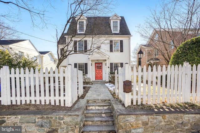 victorian home featuring a fenced front yard