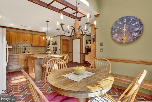 dining area with recessed lighting, visible vents, brick floor, and a chandelier
