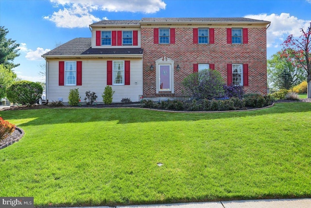 colonial home with a front yard