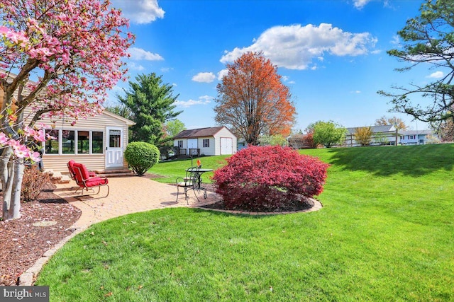 view of yard with an outdoor structure and a patio