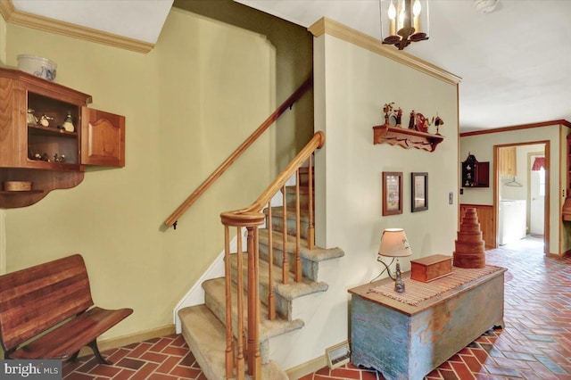 staircase featuring ornamental molding, brick floor, and baseboards