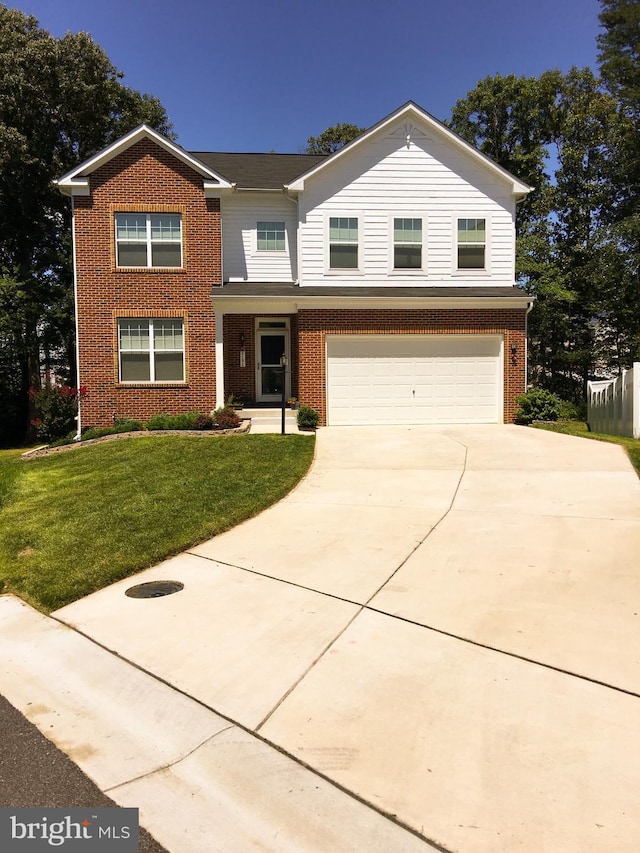 view of front of home with brick siding, a garage, a front yard, and concrete driveway