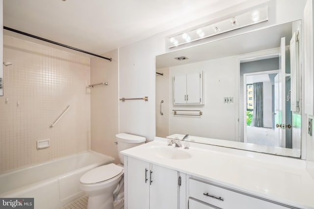 full bathroom featuring washtub / shower combination, toilet, and vanity