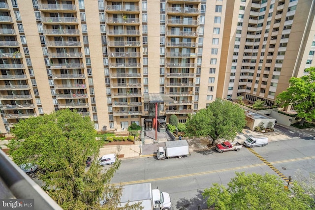 view of building exterior featuring uncovered parking