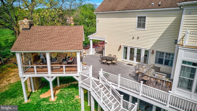 12205 Thoroughbred Rd, Oak Hill, VA 20171 - wooden terrace with outdoor dining area, french doors, a yard, and an outdoor hangout area