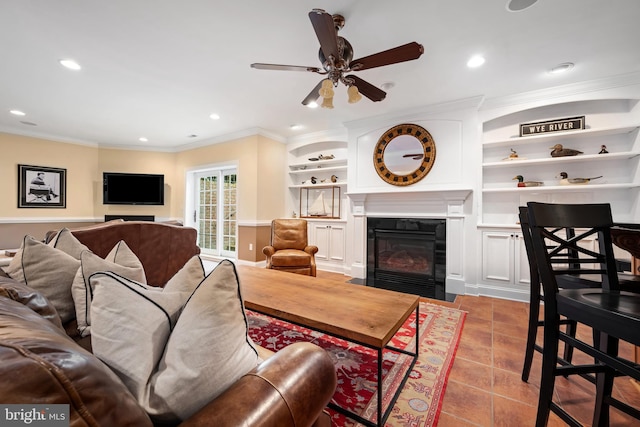 13543 Rustling Oaks Dr, Wye Mills, MD 21679 - living room featuring a fireplace with flush hearth, ceiling fan, crown molding, built in features, and recessed lighting