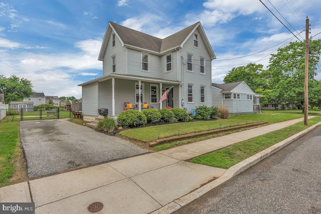 10 Turner Ave, Swedesboro, NJ 08085 - view of front of property featuring covered porch and asphalt driveway