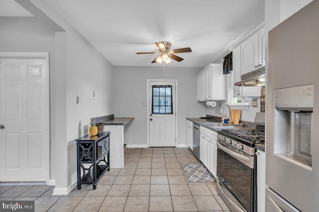 10 Turner Ave, Swedesboro, NJ 08085 - kitchen with appliances with stainless steel finishes, under cabinet range hood, a sink, and dark countertops