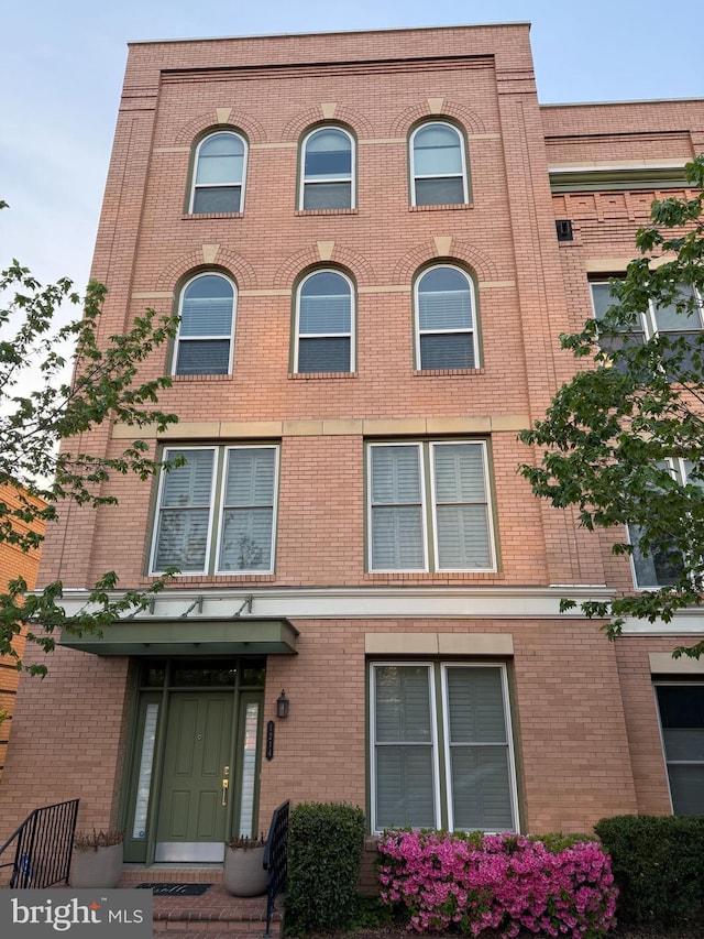 exterior space featuring brick siding