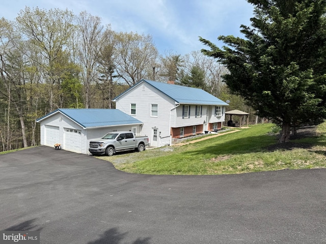 3322 Johnsons Mill Rd, Berkeley Springs, WV 25411 - view of side of home with a lawn, metal roof, and a garage