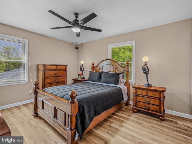 3322 Johnsons Mill Rd, Berkeley Springs, WV 25411 - bedroom featuring light wood-style floors, baseboards, and ceiling fan