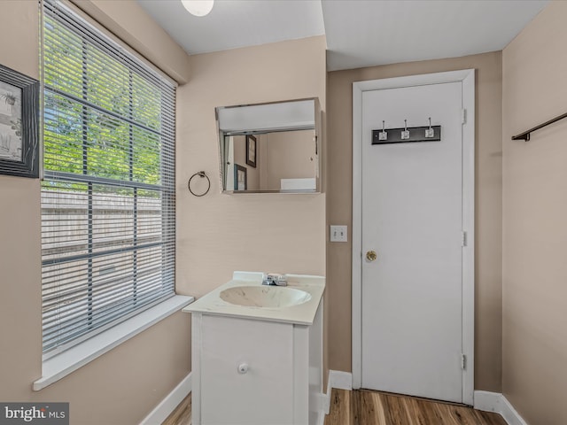 3322 Johnsons Mill Rd, Berkeley Springs, WV 25411 - bathroom featuring wood finished floors, baseboards, and vanity