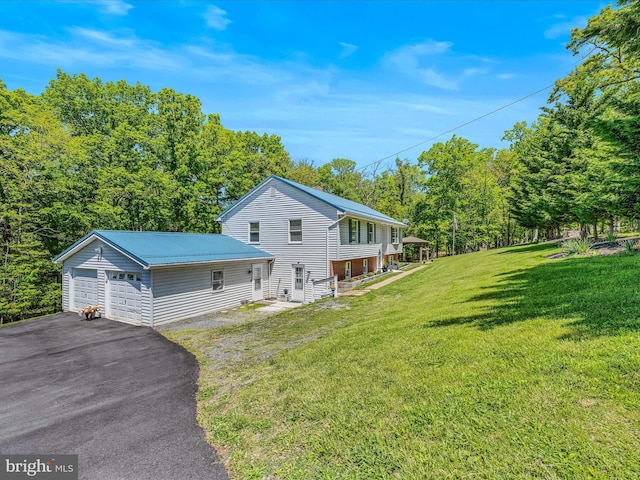 3322 Johnsons Mill Rd, Berkeley Springs, WV 25411 - view of property exterior with a detached garage, a yard, and metal roof