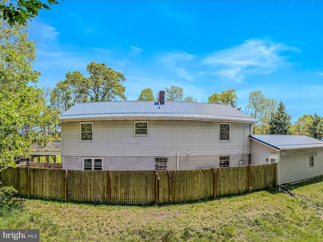 3322 Johnsons Mill Rd, Berkeley Springs, WV 25411 - back of property featuring metal roof and a chimney